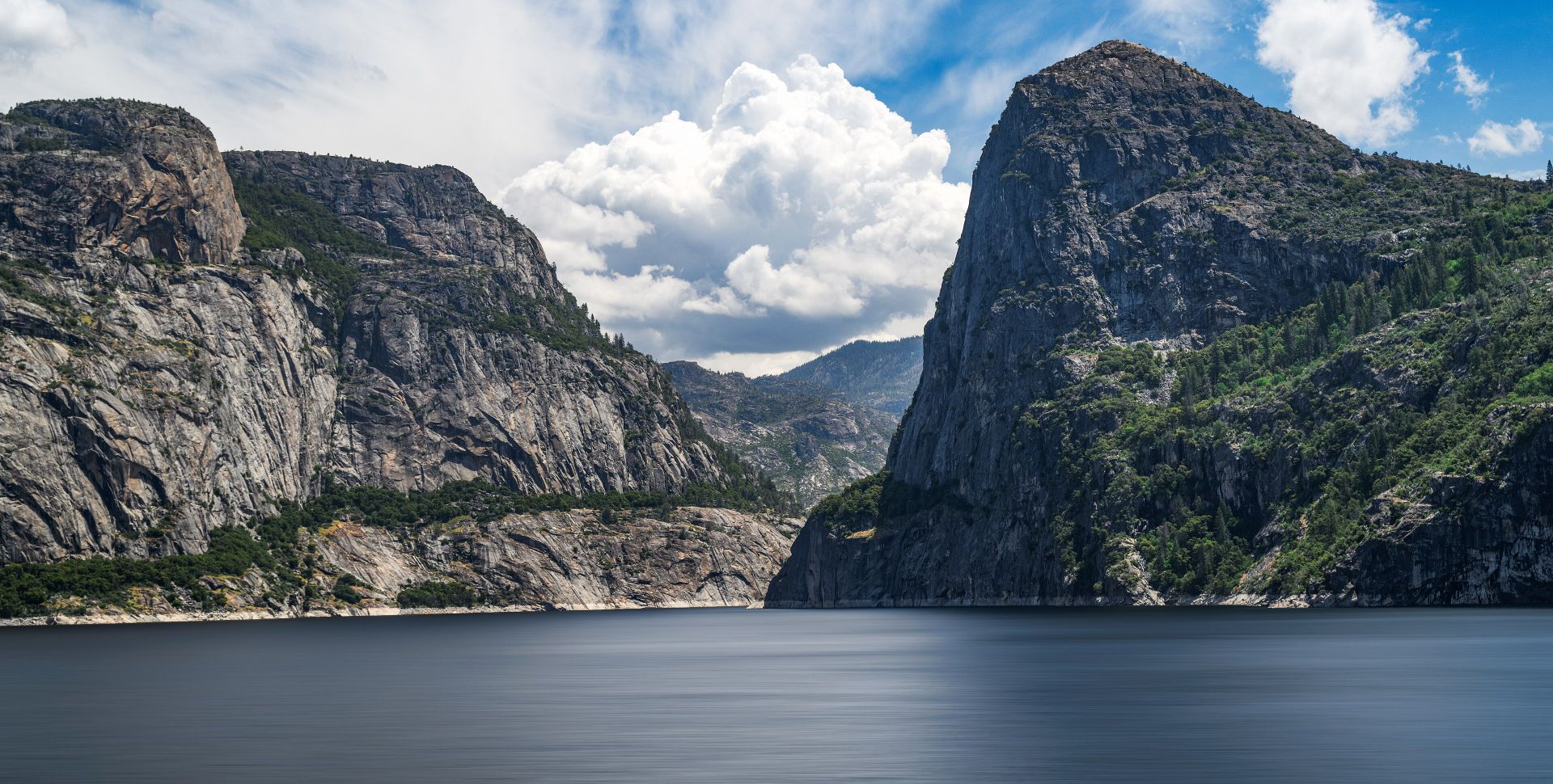 Granite cliffs and the reservoir of Hetch Hetchy Valley in Yosemite National Park