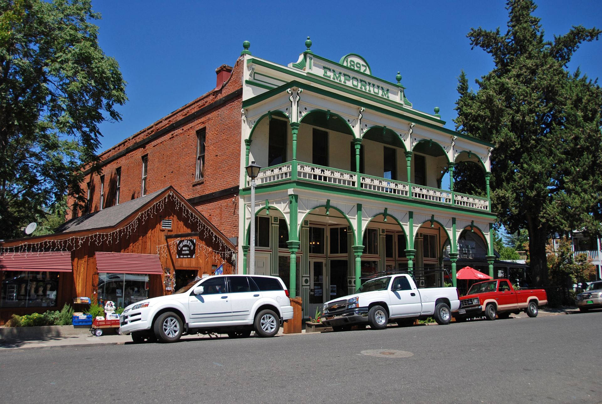 The two-story Emporium building with green balconies on Main Street in historic Jamestown